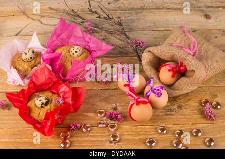 Still life with Easter eggs and small mona de Pascua cakes Stock Photo