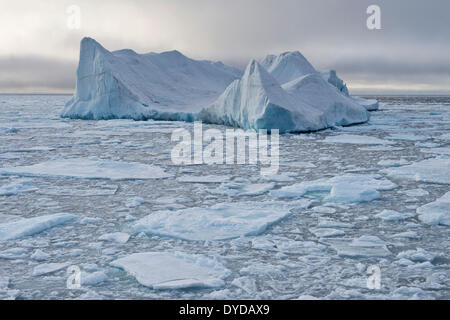 Iceberg floating in pack ice, edge of pack-ice, Arctic Ocean, Spitsbergen Island, Svalbard Archipelago, Svalbard and Jan Mayen Stock Photo