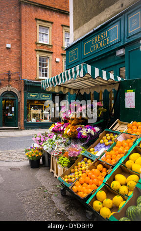Fruit and flowers displayed outside an independent greengrocer's  shop. Stock Photo