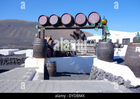 Barrels form an arched entrance to wine Bodega Suarez in the wine growing region of La Geria, Lanzarote, Canary Islands, Spain Stock Photo