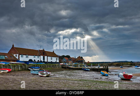 Sun beams over Burnham Overy Staithe. Stock Photo