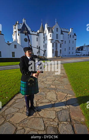 A Scottish piper outside Blair Castle. Stock Photo