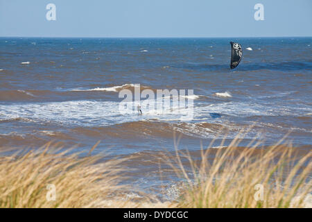 Kite surfing at Sea Palling on the Norfolk coast. Stock Photo