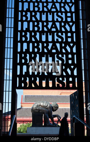 A man enters the British Library through  metal gates. Stock Photo