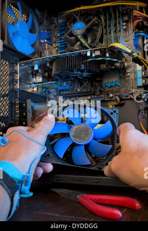 Repairs inside a desktop computer. Stock Photo