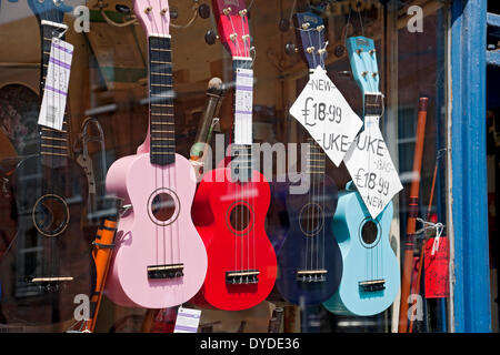 Ukuleles for sale in a shop window. Stock Photo