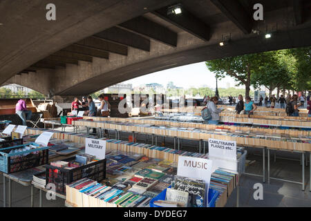 Second hand book stall under Waterloo bridge on the South Bank of the Thames in London. Stock Photo