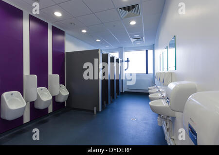 Unoccupied male public toilets in commercial building. Stock Photo