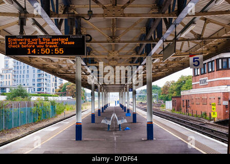 Empty platform at Woking station with engineering work electronic sign. Stock Photo