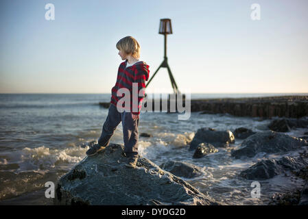 Playing by the sea in spring time. Stock Photo