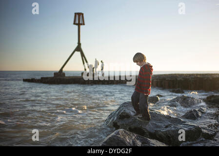 Playing by the sea in spring time. Stock Photo