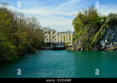 Cottage on the water in a park (Echologia park in Mayenne, Loire country, France). Stock Photo