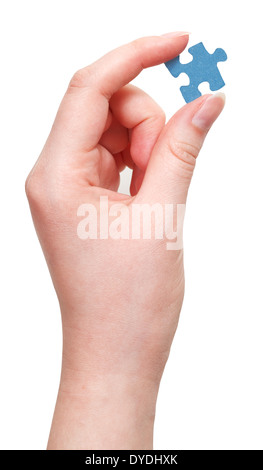 female hand holding blue puzzle piece isolated on white background Stock Photo
