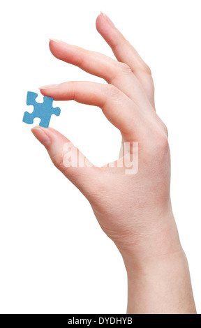 female arm with puzzle piece isolated on white background Stock Photo
