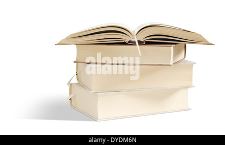 open book lies on several books on top. isolated on white. clipping, path Stock Photo