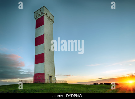 Sunset at the Gribbin Head lighthouse in Cornwall Stock Photo