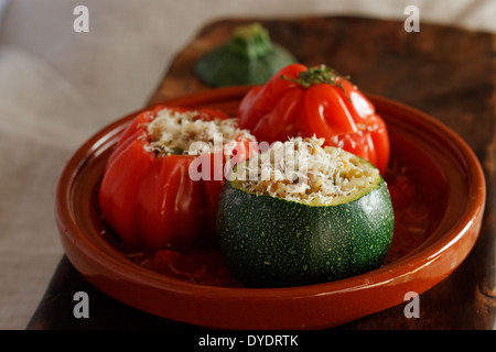 Baked tomatoes and courgettes stuffed with rice Stock Photo