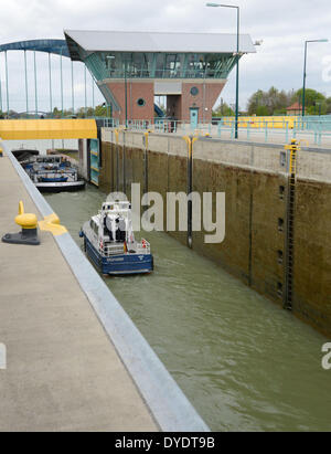 Muenster, Germany. 15th Apr, 2014. Ships sail through the new twin sluice at the Dortmund Ems Canal in Muenster, Germany, 15 April 2014. After five years of construction the twin twin sluice is opened. The project is part of the extension program on the section between Dortmund and the Midland Canal. Photo: Caroline Seidel/dpa/Alamy Live News Stock Photo