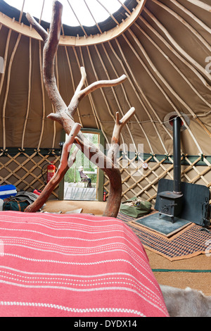 The interior of the yurt 'Coracle' at the luxury glamping site Crafty Camping at Holditch, Dorset UK Stock Photo