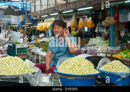 Bangkok, thailand  - Woman at flower market posing for camera Stock Photo