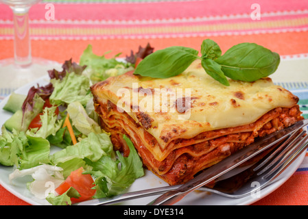 Beef Lasagne al Forno with salad - studio shot Stock Photo