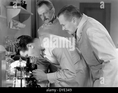 Richard Barthelmess (center) & John St. Polis (rear), on-set of the Film, 'Alias the Doctor',  1932 Stock Photo