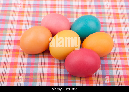 Easter colored eggs on the tablecloth. Stock Photo
