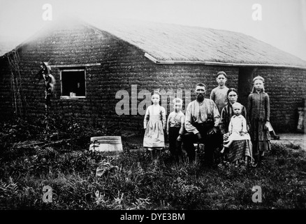 Family in Front of Sod House, Portrait, Kansas, USA, circa 1880 Stock Photo