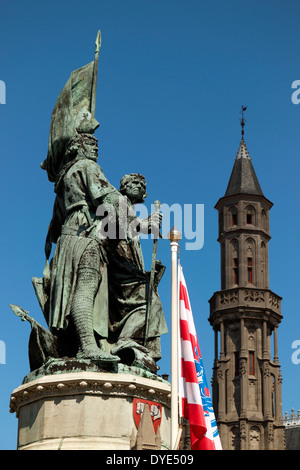 Statue of Jan Breidel and Peter de Coninck, with the Historium tower, Market Square, Bruges, Belgium Stock Photo