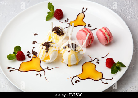 Ice cream with macaroons and berries Stock Photo