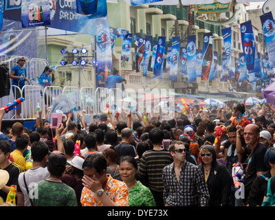 Crowd celebrating Songkran, the traditional Thai New Year, on Khao San Road in Bangkok, Thailand. Stock Photo