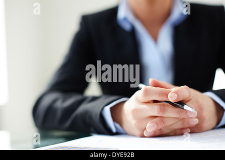 Image of female hands holding pen Stock Photo