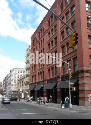 New York City tenement buildings in midtown New York. A mixture of housing and offices, this typical architecture dominated the city to the beginning of the 20th century, when elevators became widespread, enabling skyscapers. Stock Photo