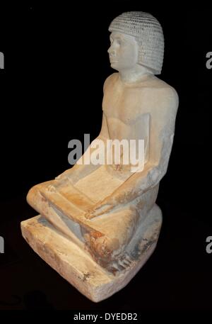 Scribe seated cross-legged, a papyrus on his knees 2350 B.C. Stock Photo