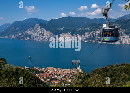 A Cable Car Above The Town Of Malcesine, Lake Garda, Italy Stock Photo