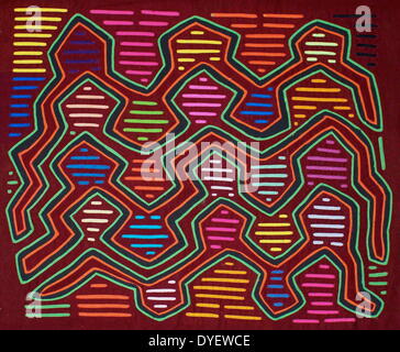 Mola textile by Kuna Indian artist, with an abstract pattern.  From the San Blas Archipelago, Panama.  Reverse applique design worn on female blouse. Stock Photo