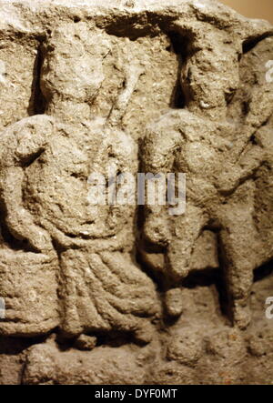 Stone tablet relief image of Mercury and Rosmerta (The Celtic goddess). Shown here as the great provider. Found in the Roman Baths in Somerset, England. Circa 1st-4th century AD. Stock Photo