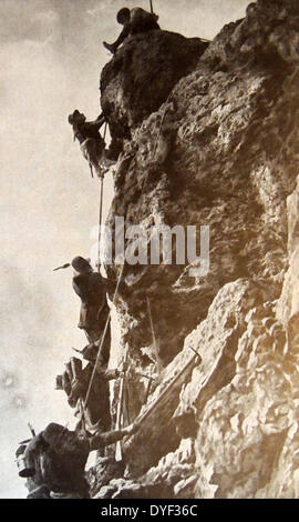 Italian troops climb the face of Monte Nero, during World war one. 1915. The 1st Alpini Regiment (Italian: 1° Reggimento Alpini) was a light Infantry regiment of the Italian Army, specializing in Mountain Combat. The Alpini are a mountain infantry corps of the Italian Army, that distinguished itself in combat during World War I and World War II. Stock Photo