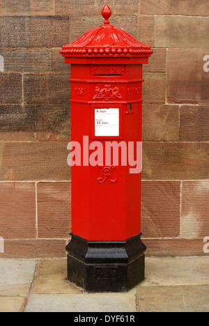 British Victorian style cast iron post box for sending letters Stock Photo