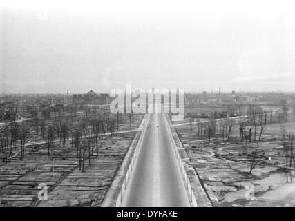 A view of the nearly treeless Grosser Tiergarten along Charlottenburger Chaussee (today Strasse des 17. Juni) looking towards the Brandenburg Gate in Berlin, Germany, 1948. After being severly damaged in WWII, a large part of the remaining trees were cut down and burned for heating due to a lack of coal. The open areas were used to plant vegetables which were vital to survival. As part of an emergency program, Tiergarten was reforested between 1949 and 1959. Photo: zbarchiv - NO WIRE SERVICE