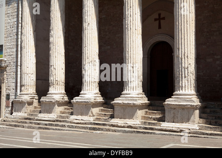 Corinthian columns in the Roman facade of the Temple of Minerva, Assisi, Italy, which currently holds a church Stock Photo