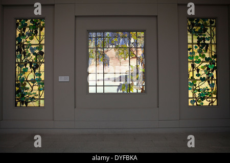 Three Tiffany glass window panels in The Metropolitan Museum of Art, New York City Stock Photo