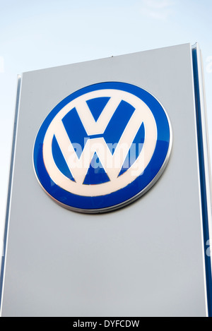 VW sign at a garage, UK. Stock Photo