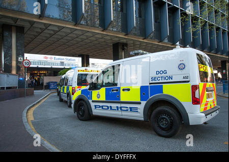 London, UK. 16th April 2014. . Metropolitan Police Dog Section Vans wait outside as thousands of commuters wait outside Euston Station whilst emergency serves deal with a fire alert. Credit:  Pete Maclaine/Alamy Live News Stock Photo