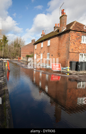 Road Closed sign due to flooding in Water Lane, Winchester Hampshire. Flooding is becoming more frequent with climate change. Stock Photo