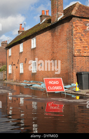 Road Closed sign due to flooding in Water Lane, Winchester Hampshire. Flooding is becoming more frequent with climate change. Stock Photo