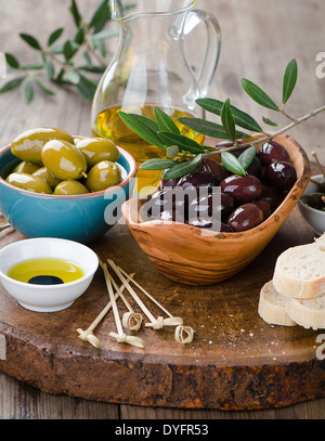Fresh olives and olive oil platter Stock Photo