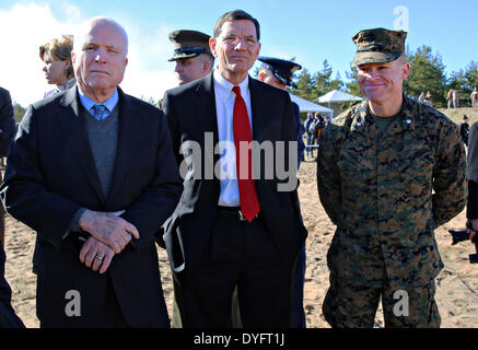US Senator John McCain and Senator John Barrasso stand with US Marine Corps Lt. Col. Trevor Hall during exercise Summer Shield during a visit to Camp Adazi April 15, 2014 in Adazi, Latvia. United States Marines are participating in the NATO exercise along with Latvian, Lithuanian and Estonian forces. Stock Photo
