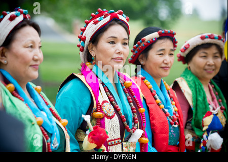 Tibetan women in traditional costume with prayer wheel, Guge Kingdom