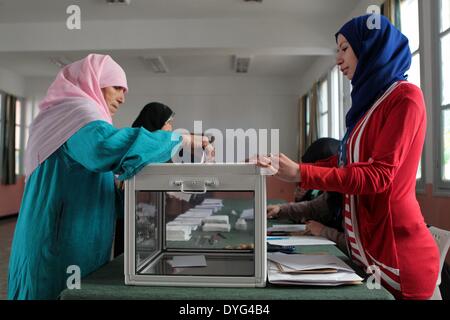 Algiers. 17th Apr, 2014. An Algerian woman casts her vote at a polling centre in Algiers on April 17, 2014. Algerian voters started casting ballots Thursday morning in the country's presidential election, which pits incumbent President Abdelaziz Bouteflika against former Prime Minister Ali Benflis and four other candidates. Credit:  Mohamed Kadri/Xinhua/Alamy Live News Stock Photo